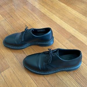 All black Dr. Martin loafers